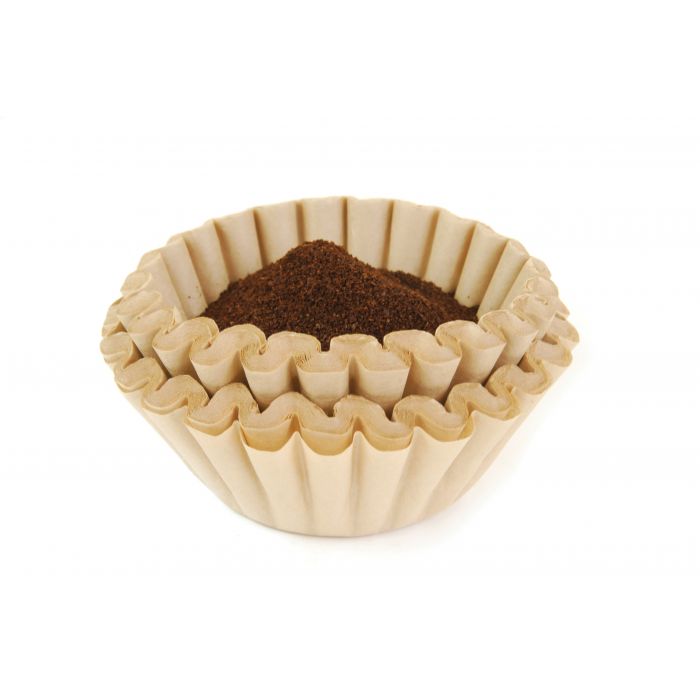 a stack of unbleached basket coffee filters filled with coffee on a white background