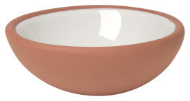 terracotta pinch bowl with white inside on a white background
