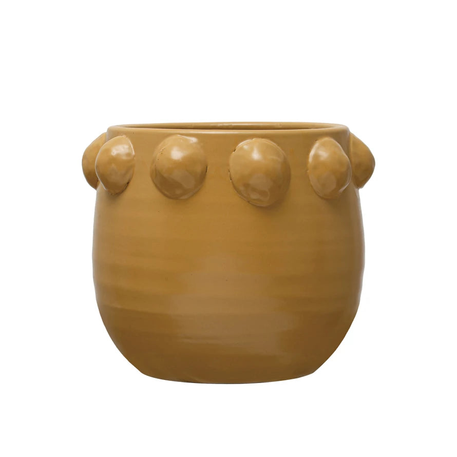 large mustard yellow planter with raised dots around upper rim.