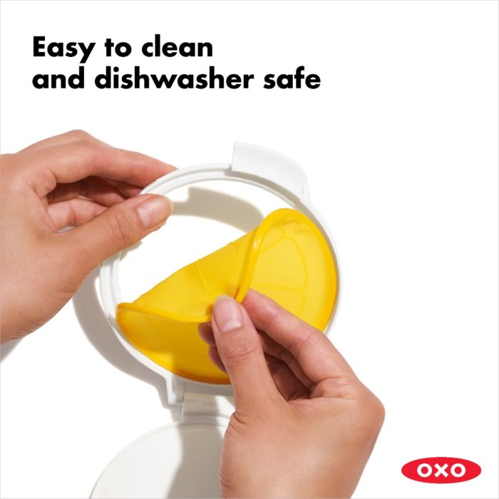 hand removing silicone top for cleaning.