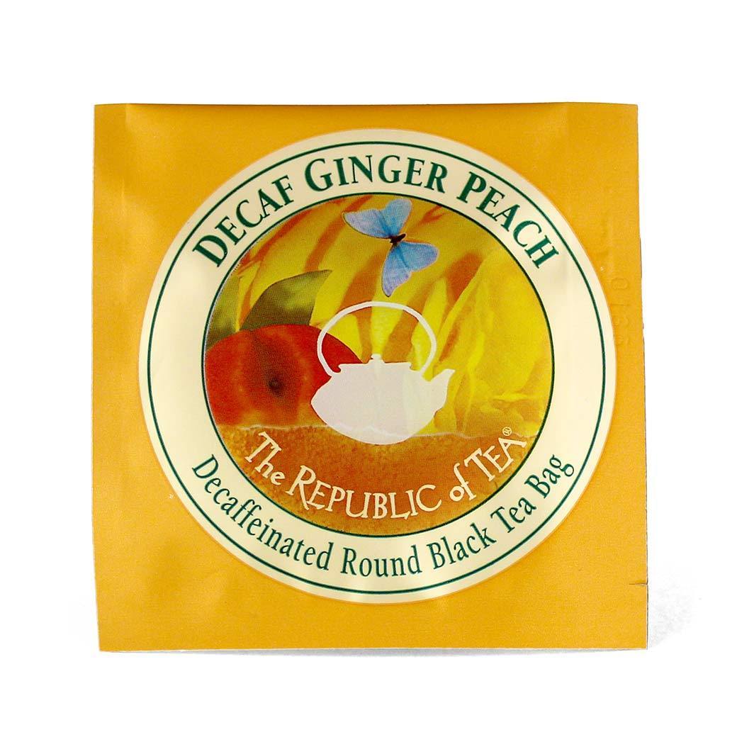individual packet of decaf ginger peach black tea on a white background