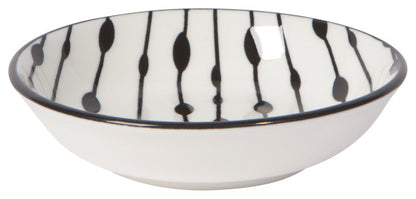 off-white bowl with black lines and dots.