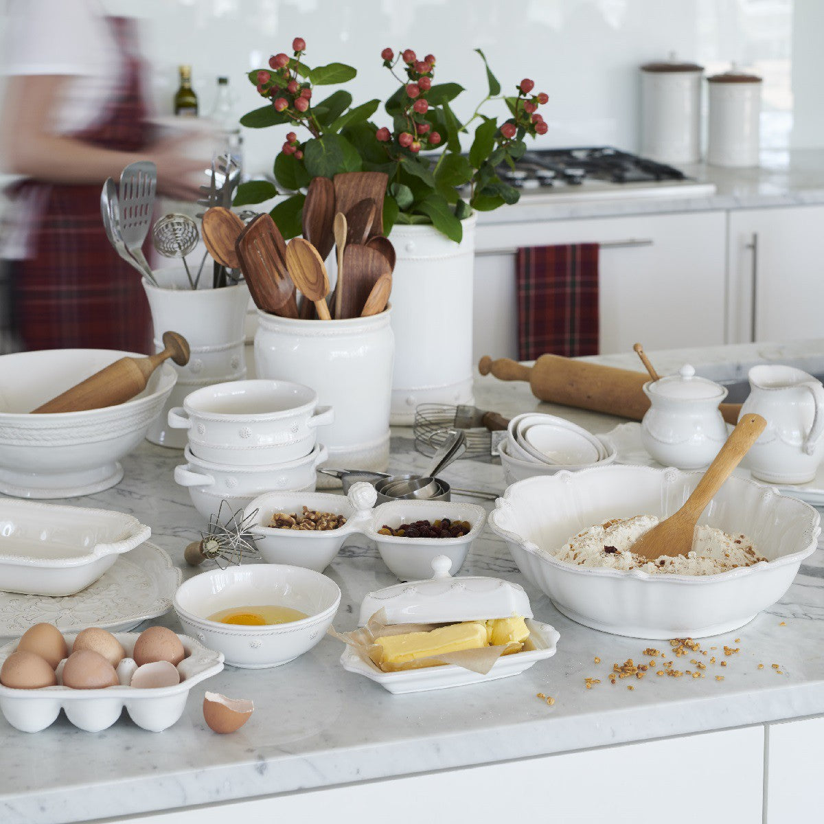illustration of a kitchen being baked in with juliska dishes scattered on the counter