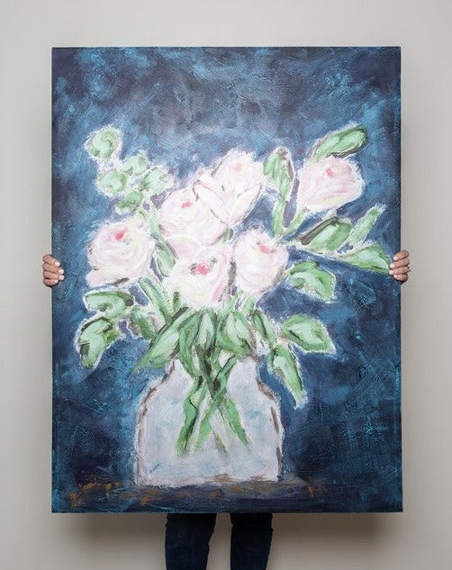 canvas art with blue background and vase of flowers and leaves.