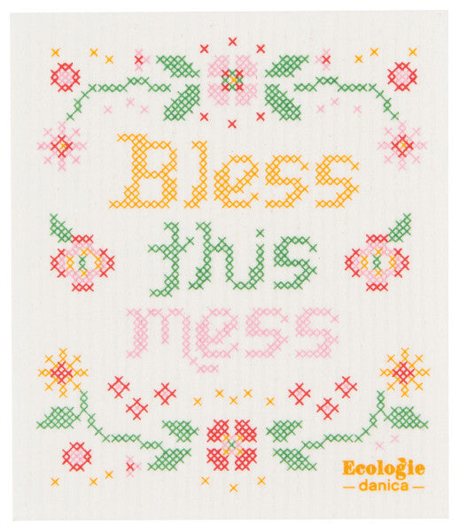 bless this mess swedish sponge cloth is white with cross stiched flowers and text "bless this mess"