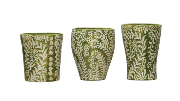 all three sizes of floral pattern stoneware cups displayed in a row on a white background