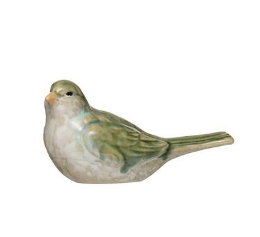 green and white ceramic bird with tail down on a white background.