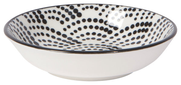 off-white bowl with dots.