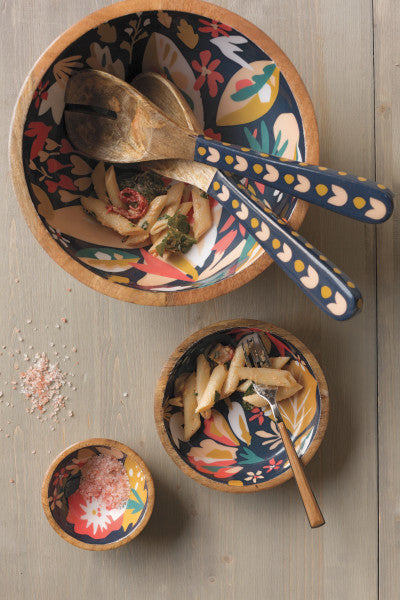 salad servers in salad bowl filled with pasta salad.