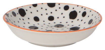 side view of dish with black dots on the interior and orange rim.