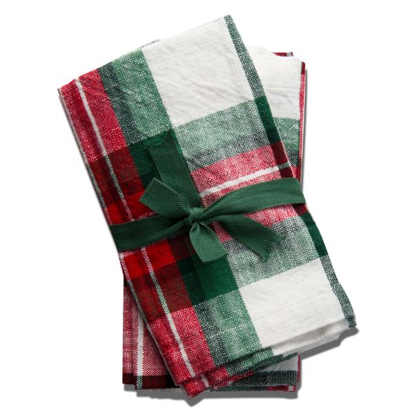 folded festive plaid napkins stacked and tied with a ribbon.