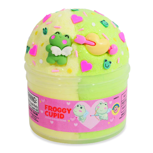 container of peachybbies yellow and green slime with cupid frogs, sprinkles, and heart charms in the slime
