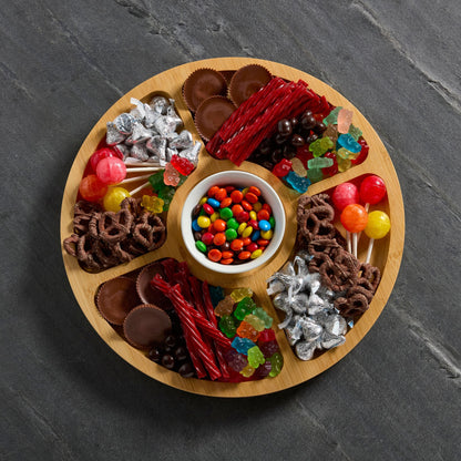 Top view of round builder board filled with assorted candies.