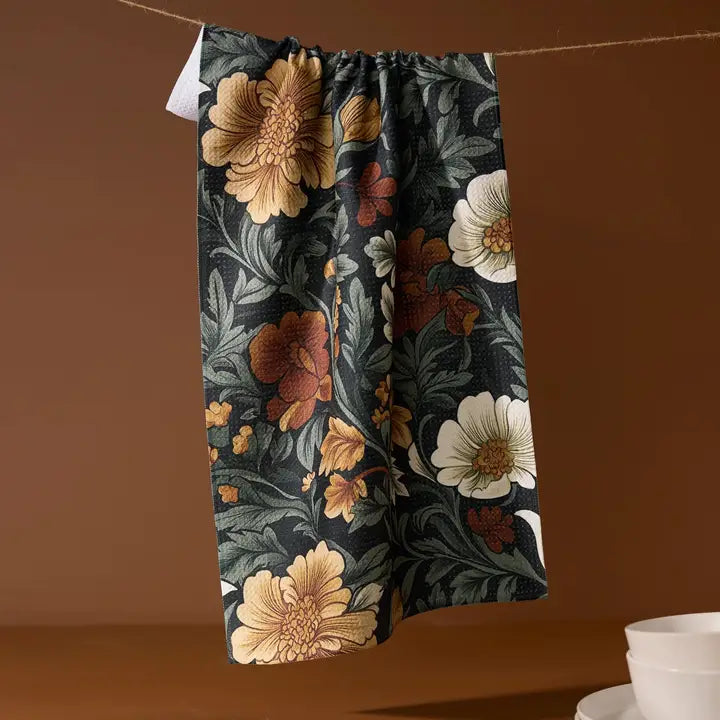 Classic Floral Tea Towel hanging from twine against a orangy brown background