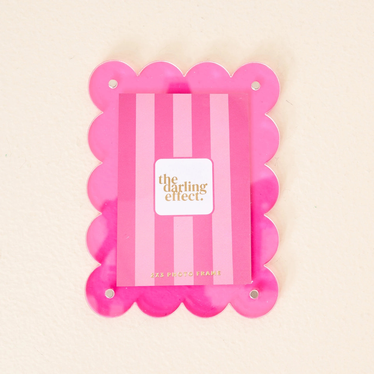 Scalloped hot pink magnetic frame against a white background.