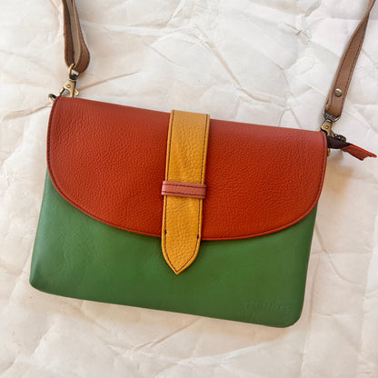 saddle bag with crossbody strap attached.