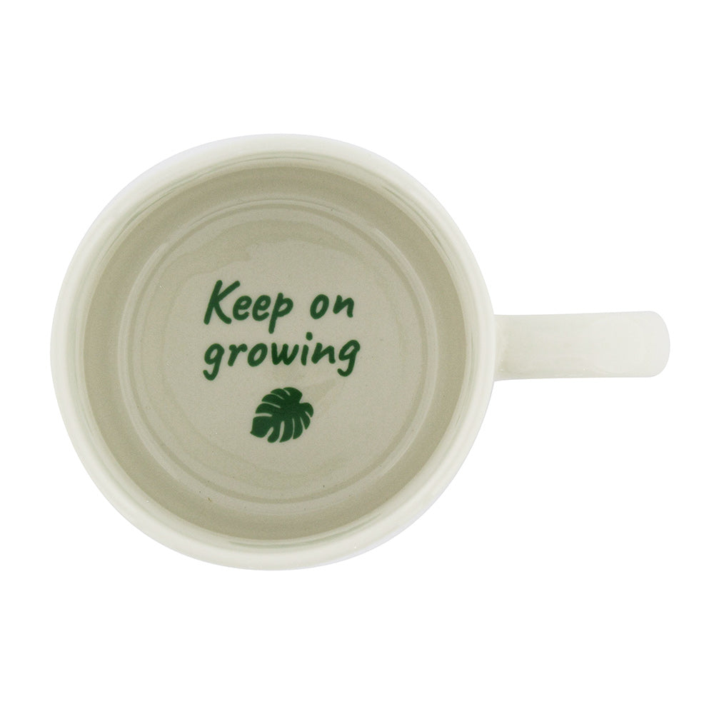 top inside view of the Houseplant Mindfulness Mug revealing the green text "keep on growing" and displayed on a white background