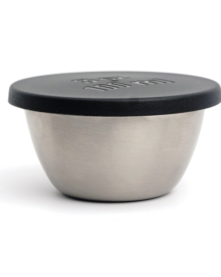stainless steel bowl with black lid shown on a white background
