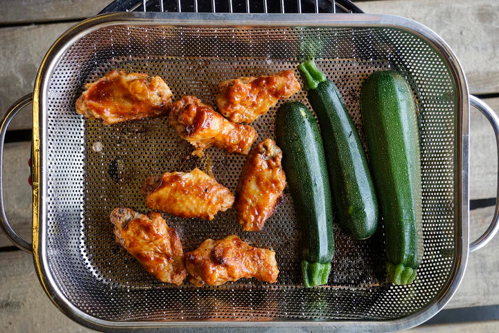 BBQ Roasting Pan with meat and veggie in set on a grill