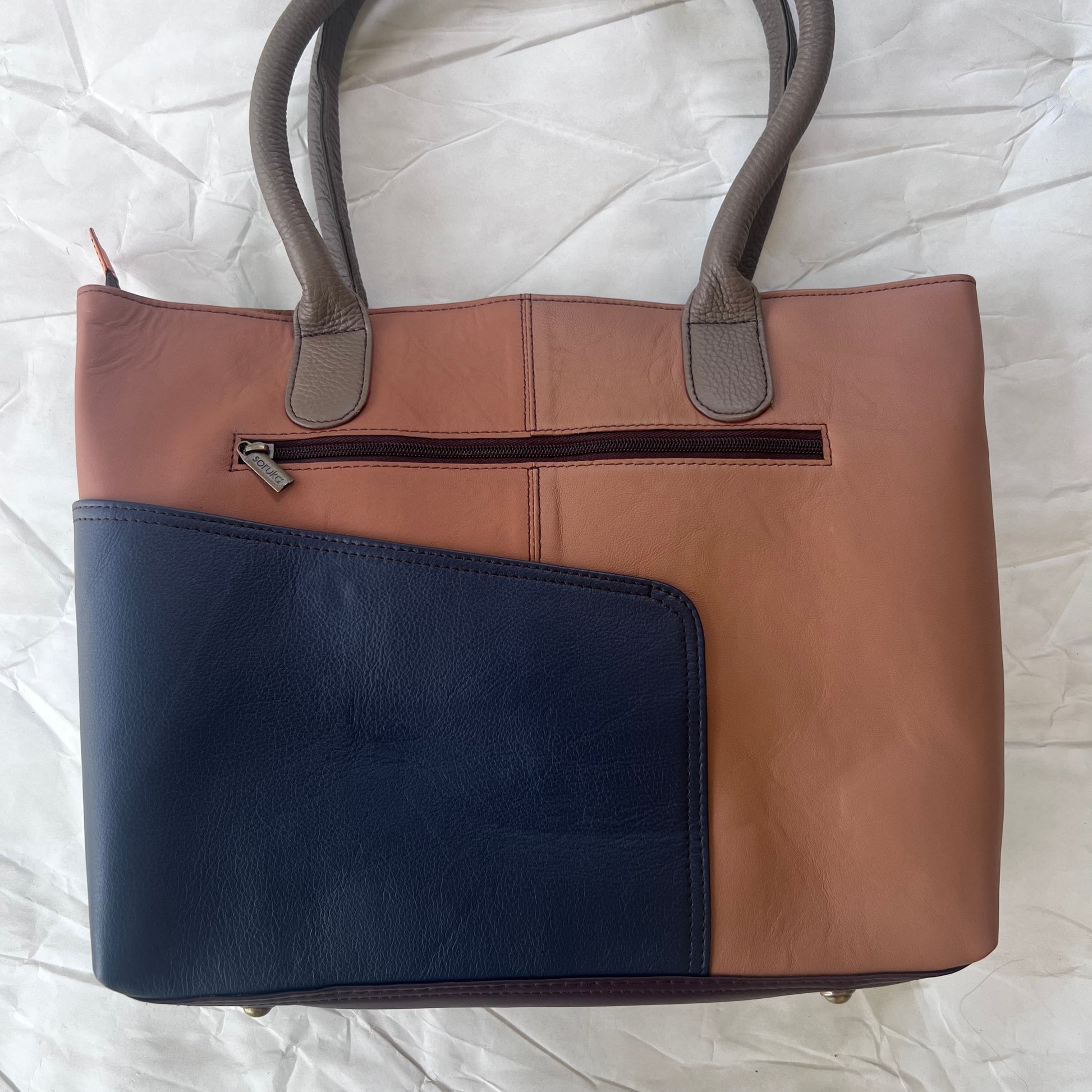 back view of wildflower sitges tote with color blocks of brown and blue