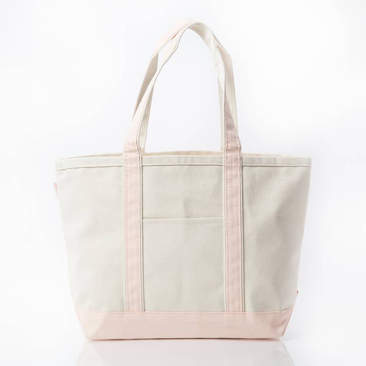 off white tote with pale pink trim and handles