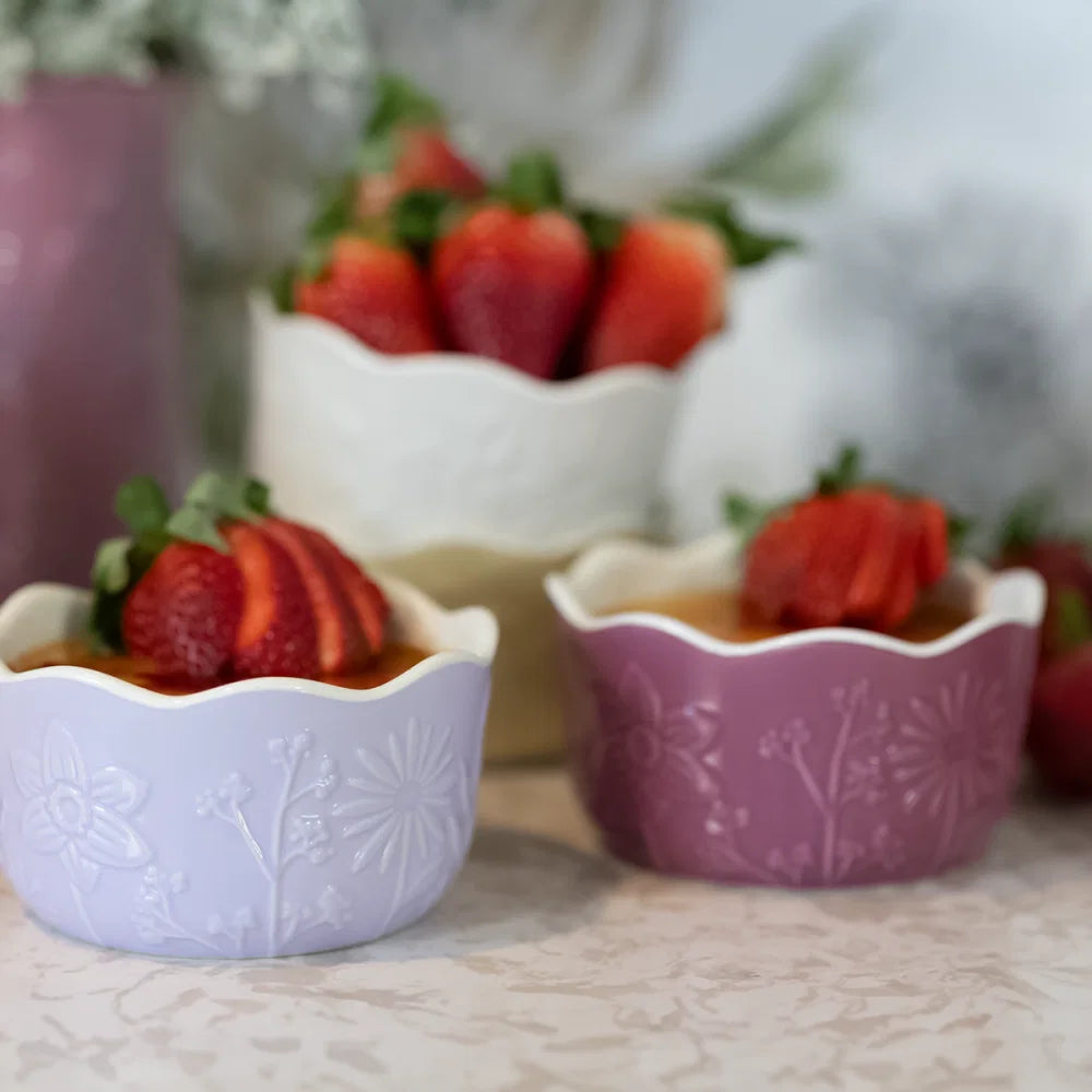 close-up of floral ramekins with berries in them