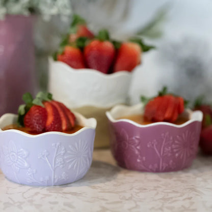 close-up of floral ramekins with berries in them