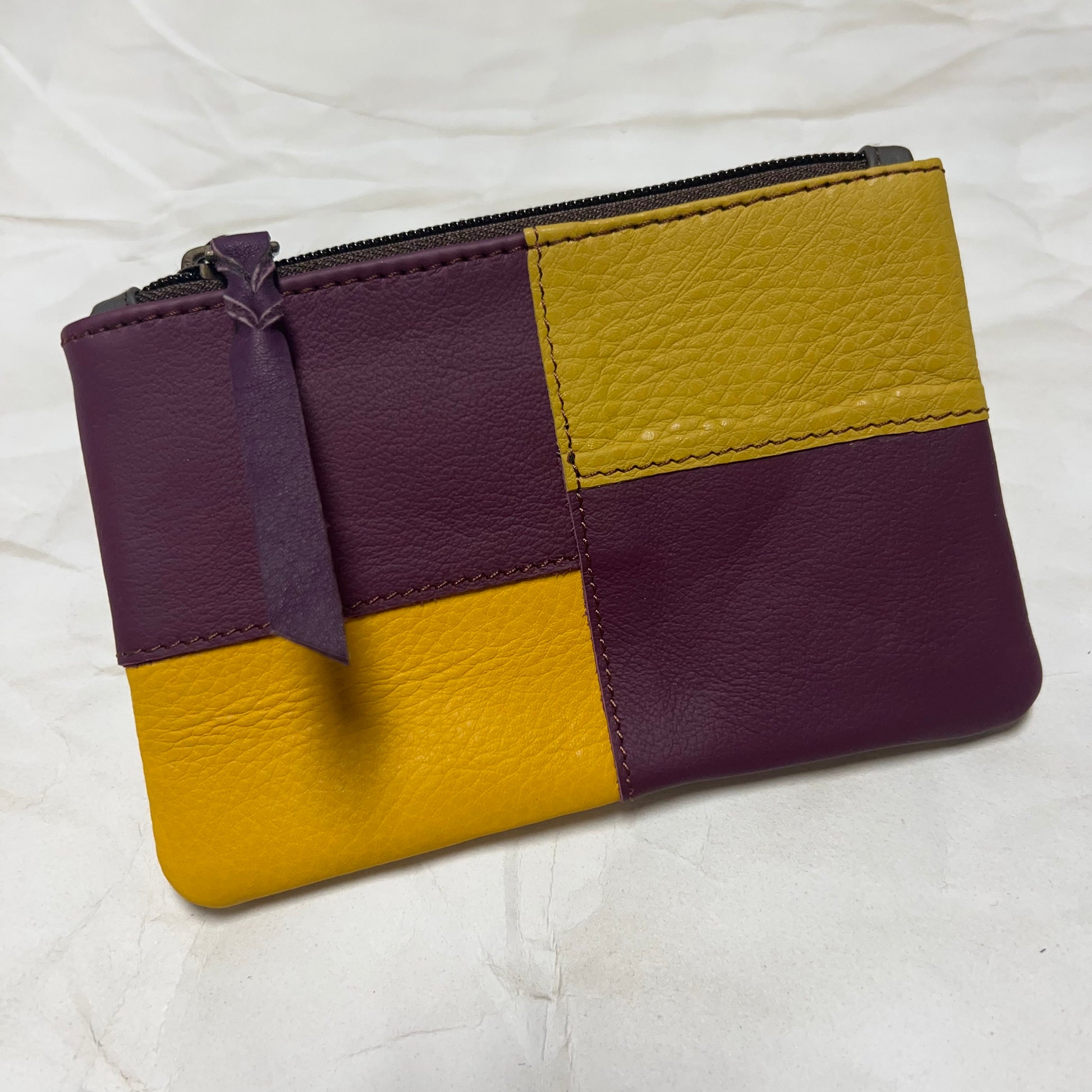 zahra pouch with maroon and yellow patchwork.