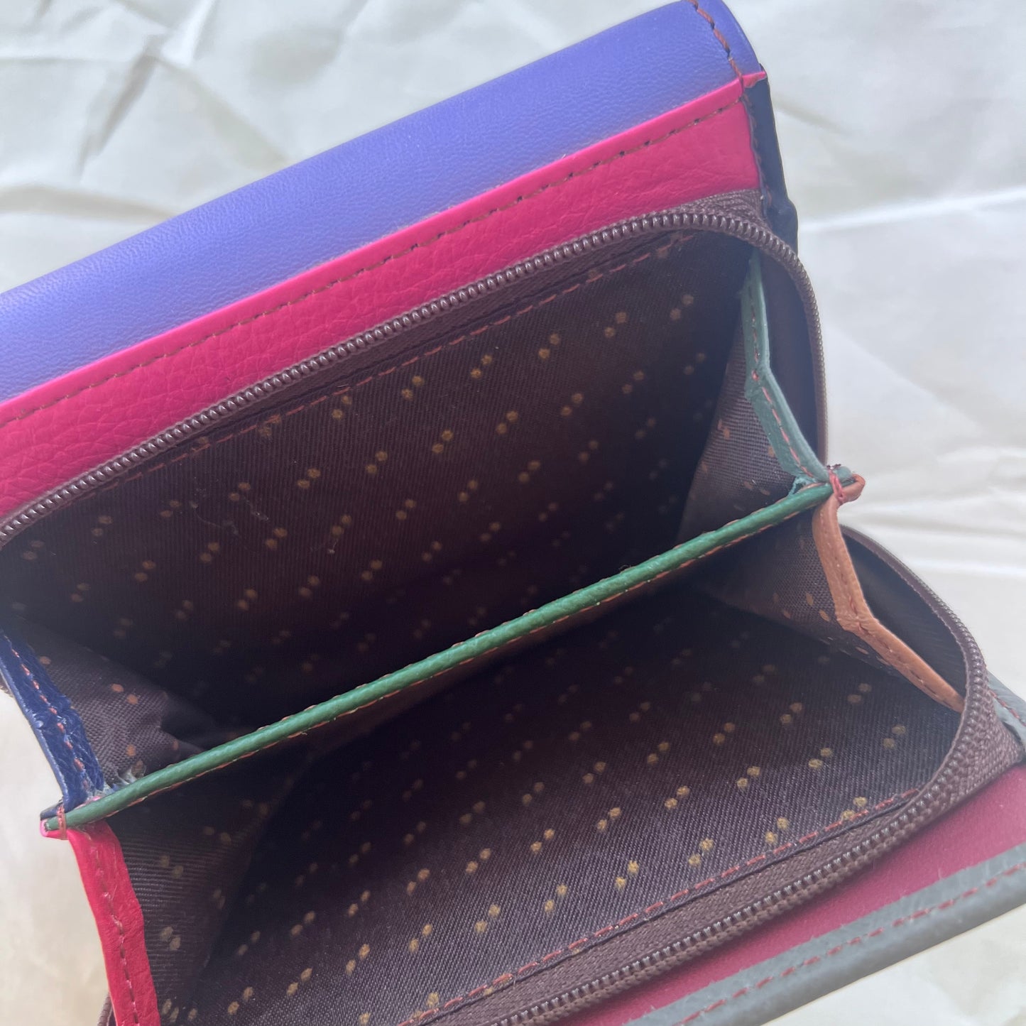 interior view of periwinkle rings wallet zipper pocket