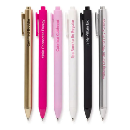 Set of 6 pens in pinks, gold, silver, and black with unique text designs on a white background