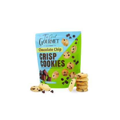 A bag of The Good Gourmet Chocolate Chip Crisp Cookies standing on a white background with several cookies scattered in front and a small stack of cookies to the right.