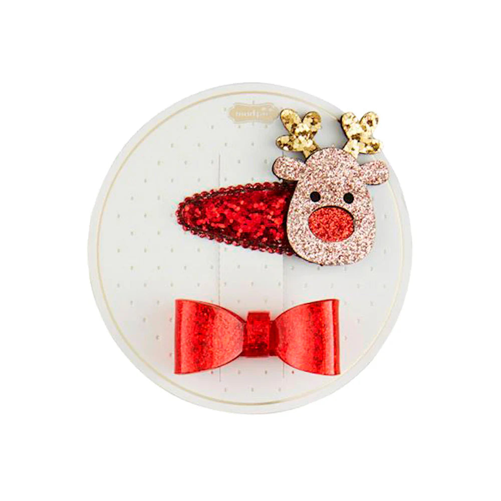 reindeer and red bow hair clip set on its card packaging.