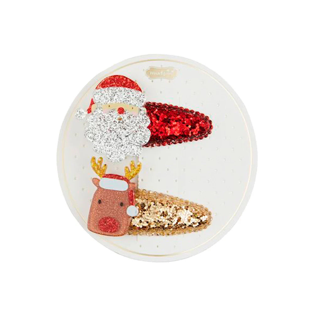 santa and reindeer hair clip set on its card packaging.