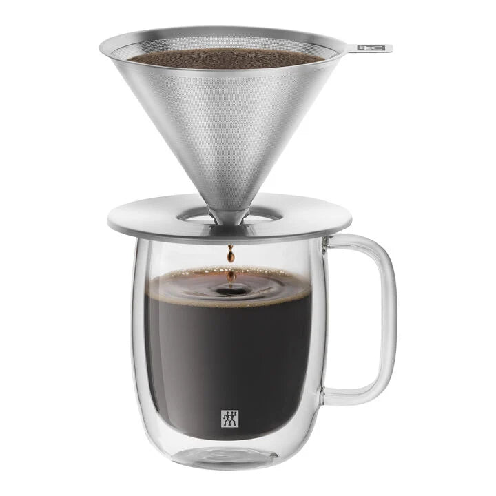 Pour Over Coffee Dripper Set with coffee grounds in the top and coffee in the cup.