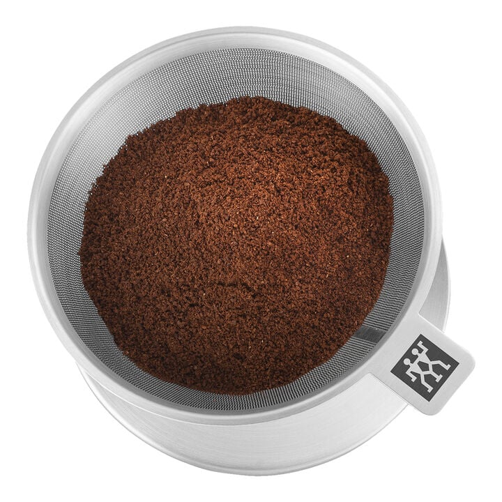 top view of filter basket filled with coffee grounds.