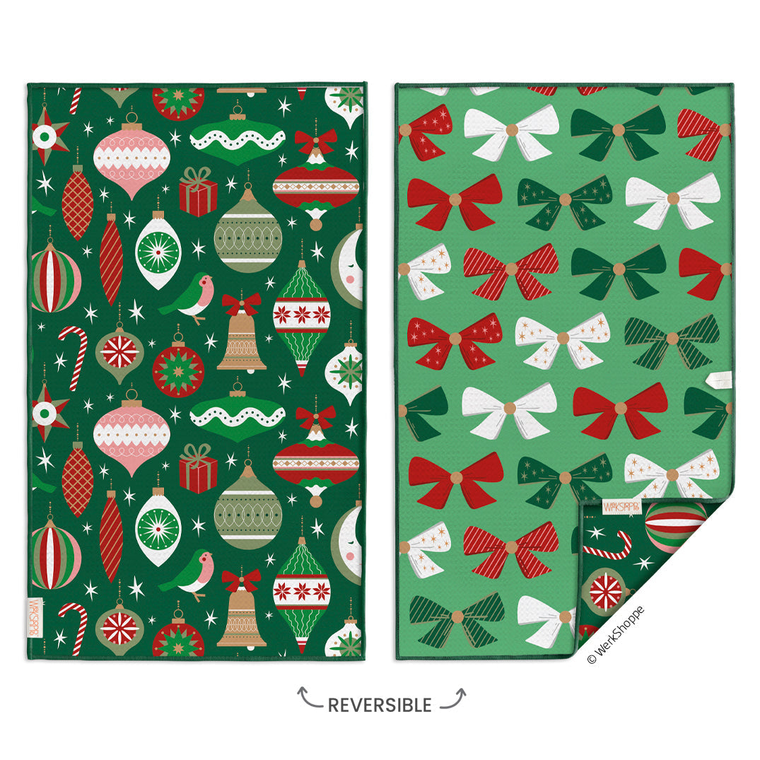 Two sides of reversible hand towel with Christmas-themed patterns on a white background