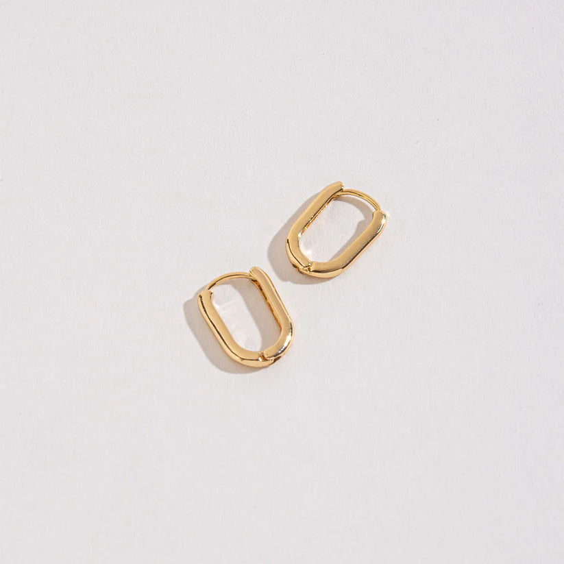 Small Link Huggie Hoops on a white background.