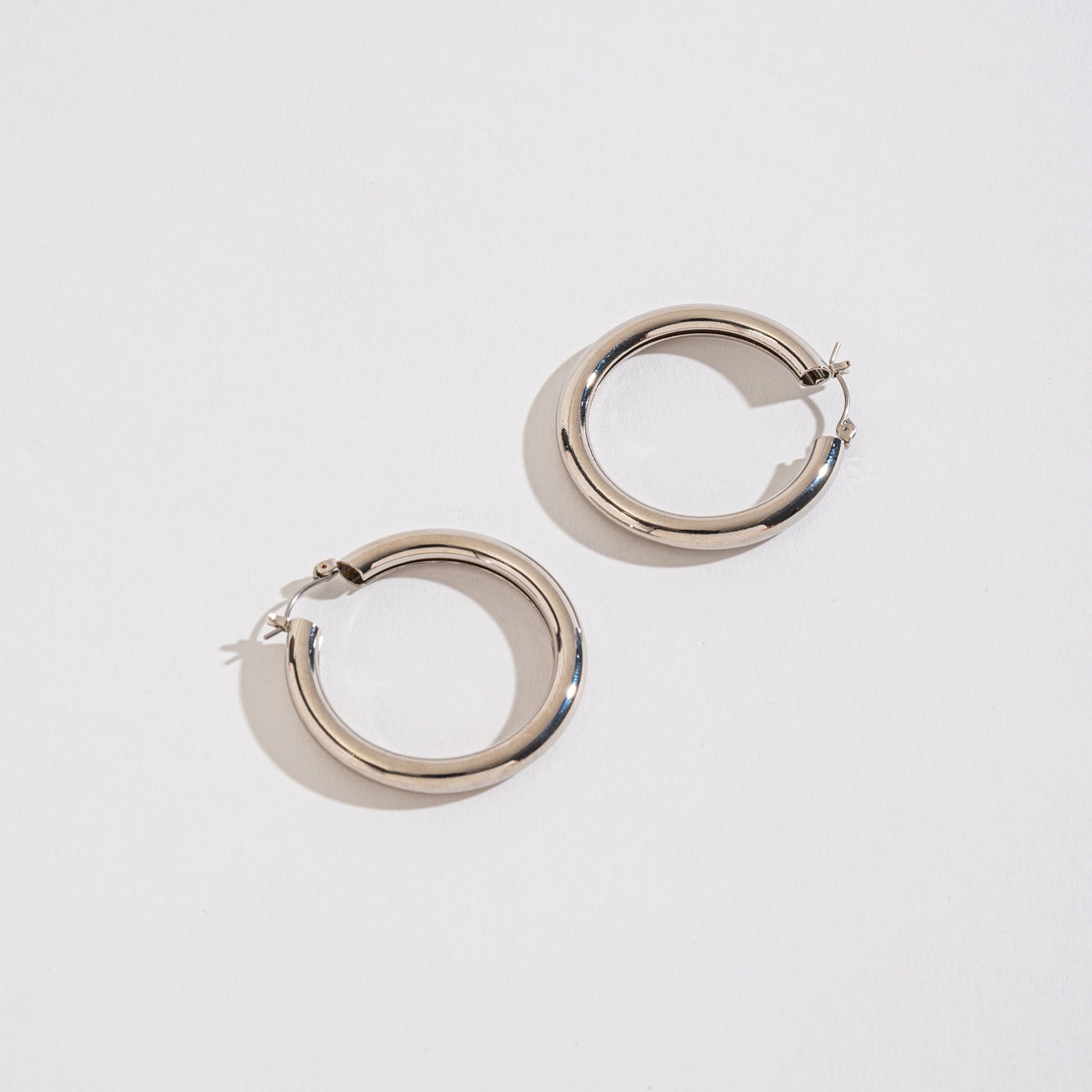 silver tube hoops on a white background.