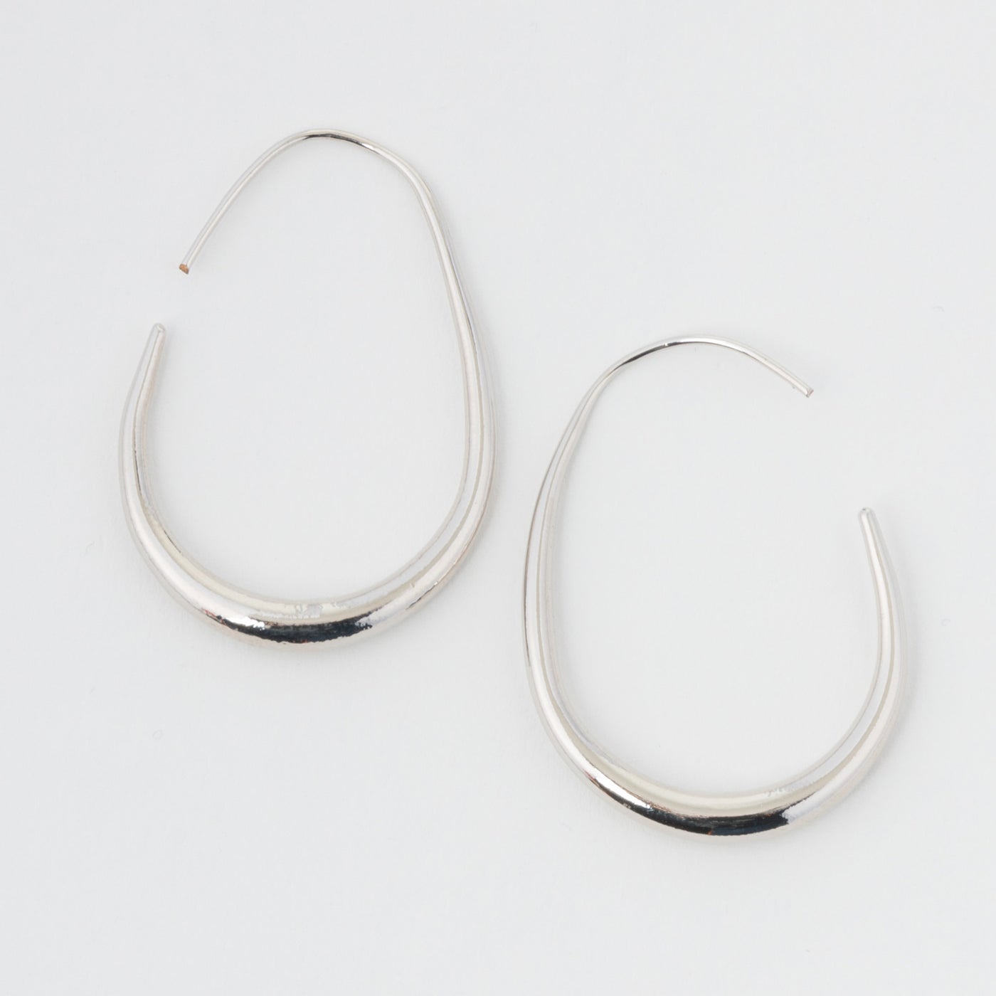 silver oval hoops on a white background.