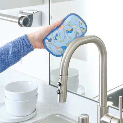 a floral finch & friends scrubbie cleaning  faucet
