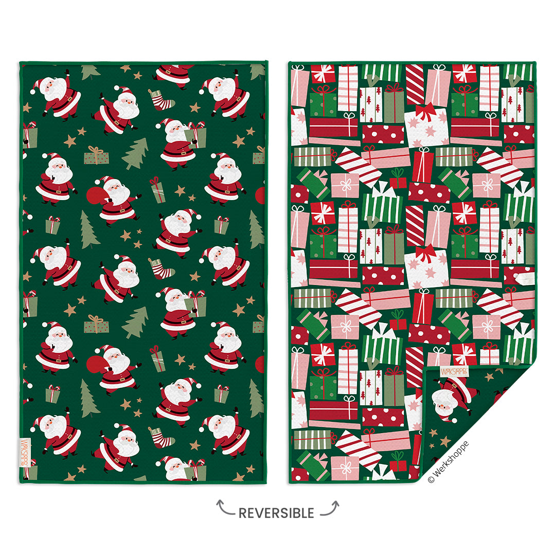two side of reversible hand towel, one with Santa Claus and the other with presents.