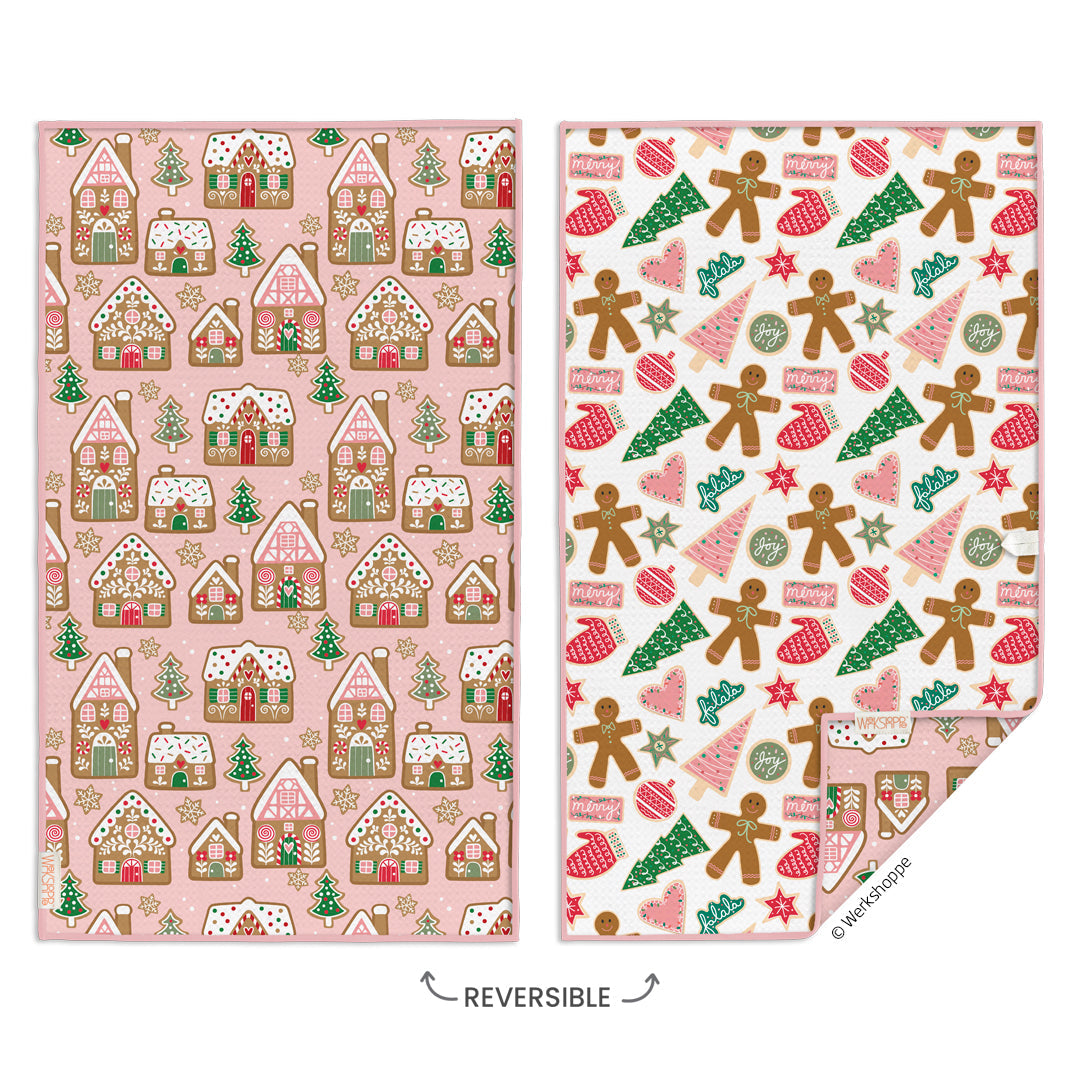 Two sides of a reversible towel with gingerbread house pattern on one side and gingerbread men pattern on the other