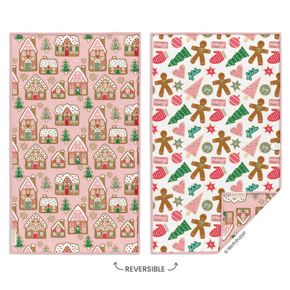 Two sides of a reversible towel with gingerbread house pattern on one side and gingerbread men pattern on the other