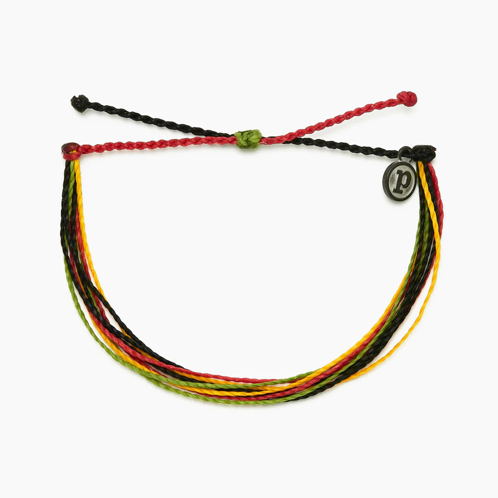 Pura Vida multi strand corded bracelet in varying shades of red, green, orange, and black with a Pura Vida logo charm