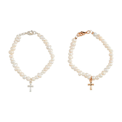 Two pearl bracelets with cross pendants on a white background
