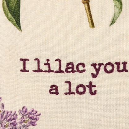 close-up of "I Lilac You A Lot" embroidered on towel