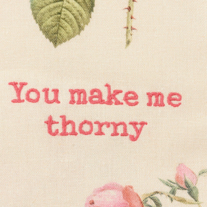 close-up of embroidery on You Make Me Thorny Dishtowel