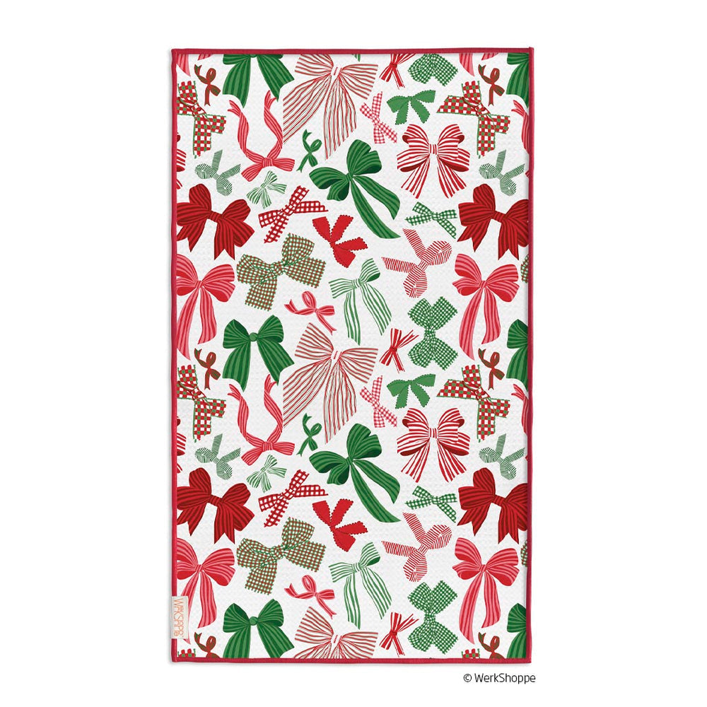 white towel with all-over design of assorted red and green bows