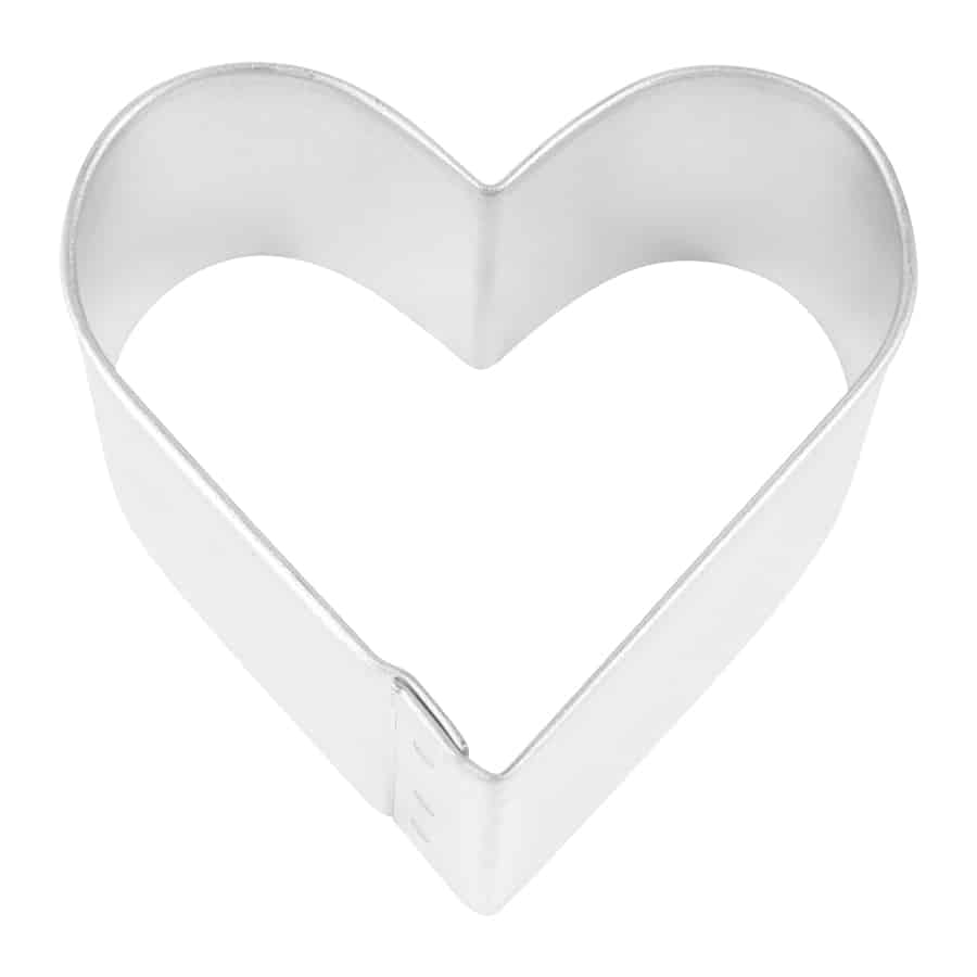 Metallic heart-shaped cookie cutter on a white background