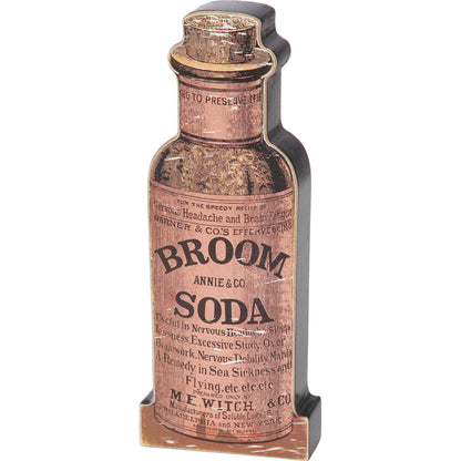 Vintage-style wooden bottle cut-out labeled 'Broom Soda' on a white background
